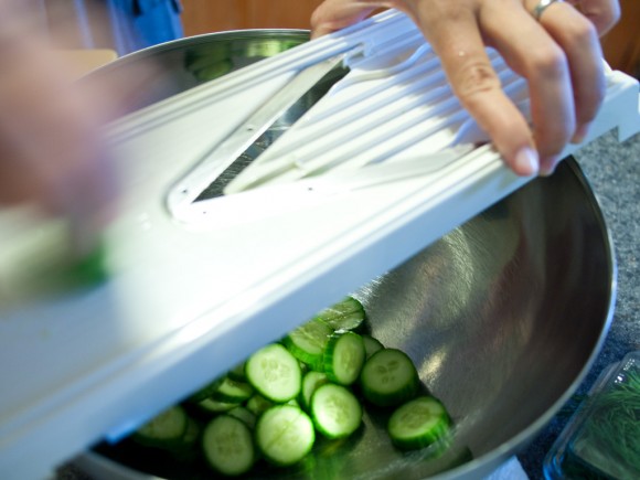 slicing cucumber with mandolin slicer
